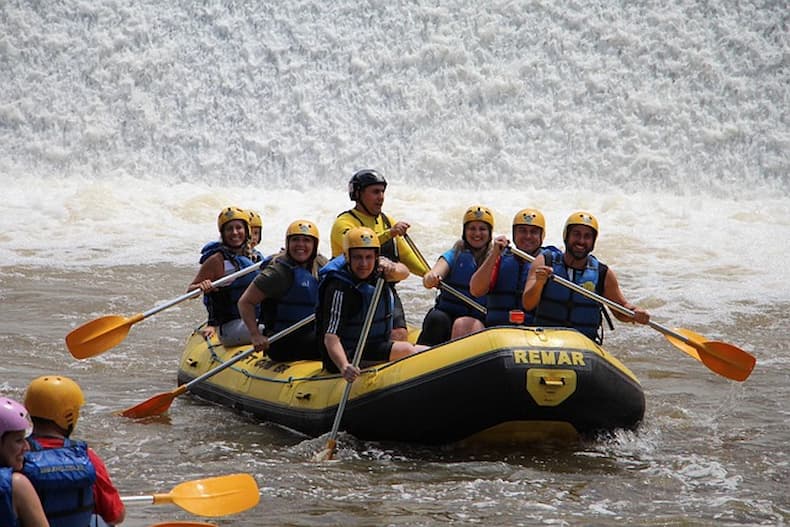A rafting team celebrating that just made it through the greater pullapansak waterfall