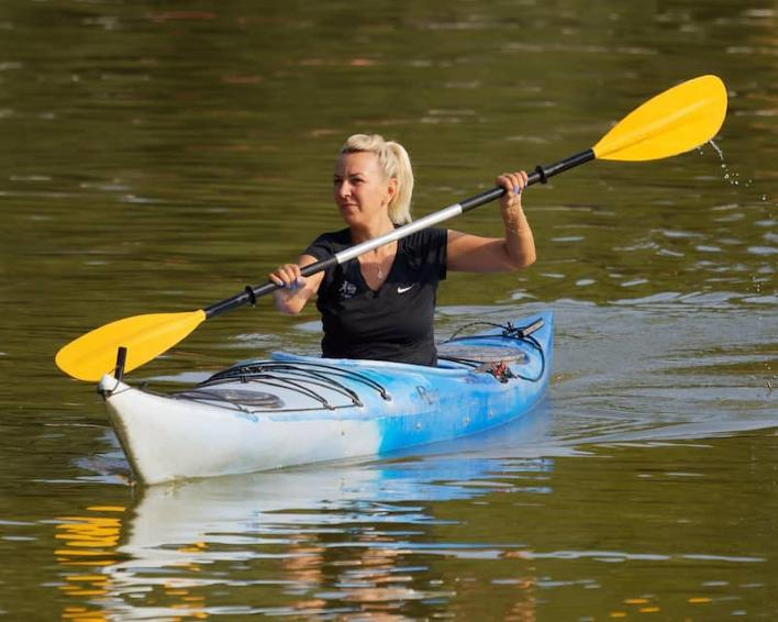 Sasha, our cheer manager paddling on still water in riverside