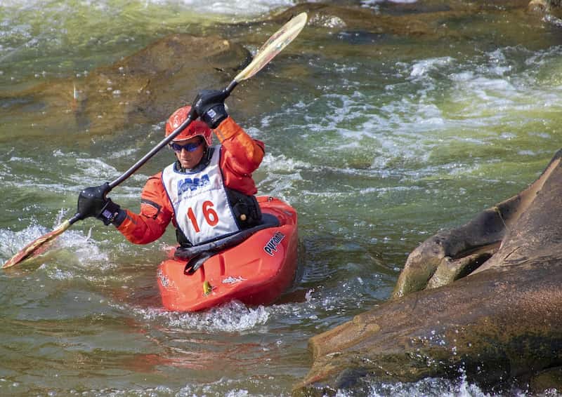 Tom, our oldest team rafting member going down through the comayagua river on a kayak